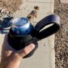 Attach a beverage can to a dog leash